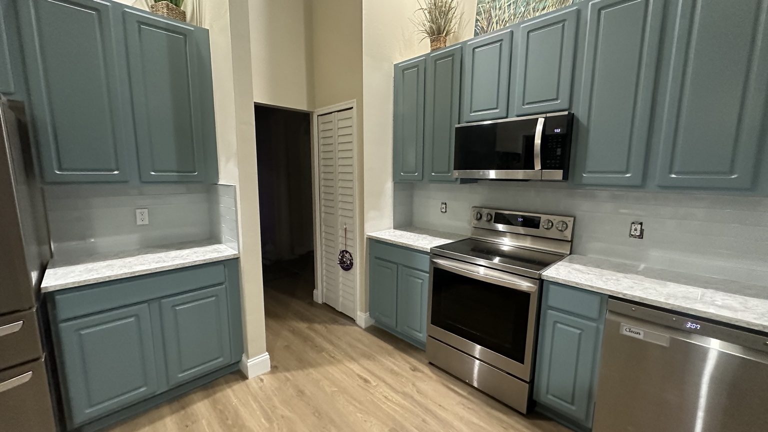 Billko cabinet painting project: blue-green painted kitchen cabinetry