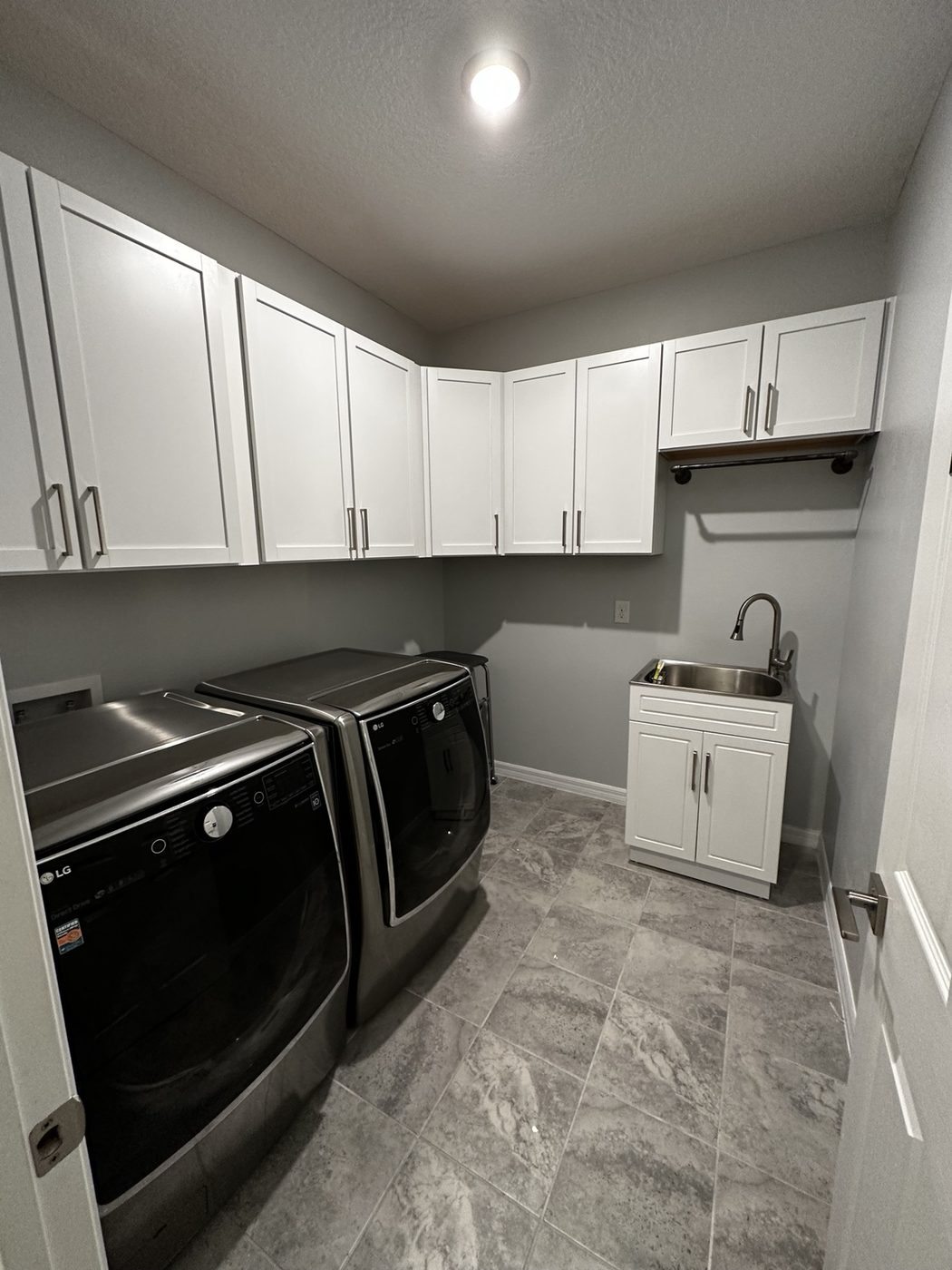 Finished cabinetry with installed hardware