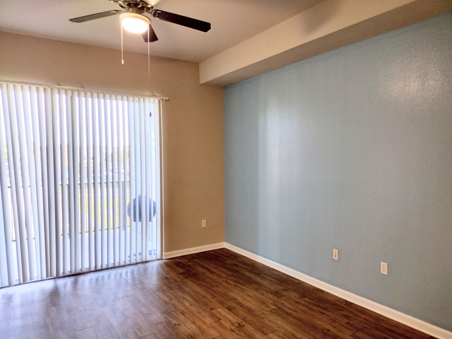 Finished residential room with blue accent wall
