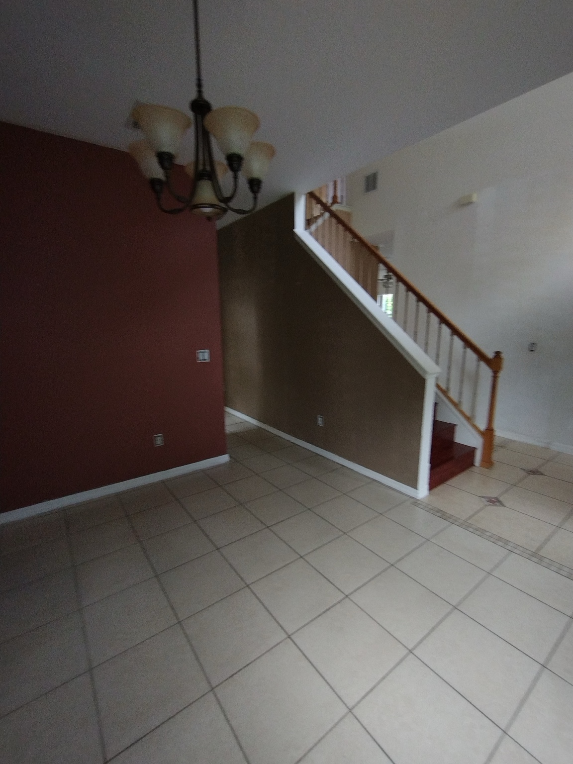 Before interior painting transformation with dark red and brown walls